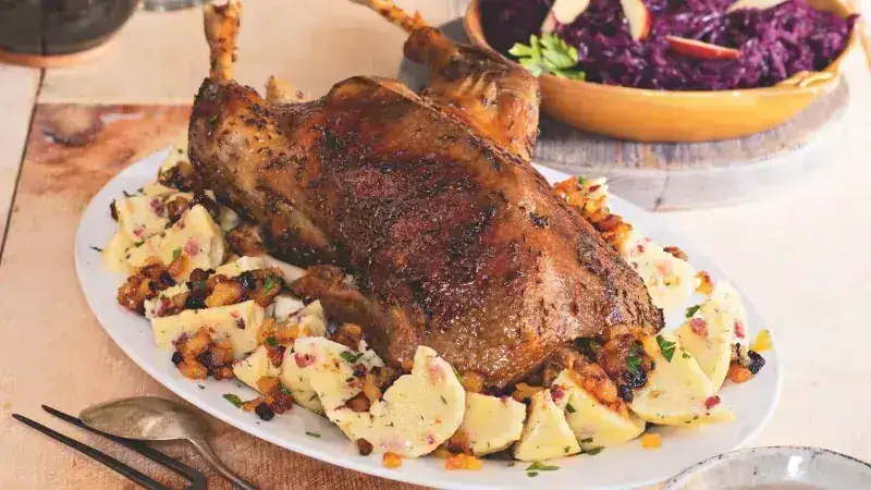 Roast goose with cabbage, potato dumplings and apple cracklings