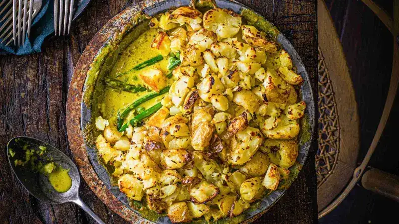 Baked potatoes with paneer cheese and coconut milk