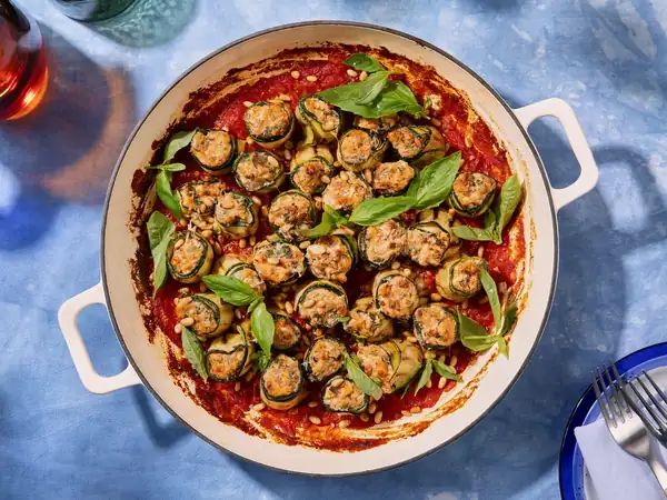 Zucchini involtini with antipasti ricotta filling and pine nuts