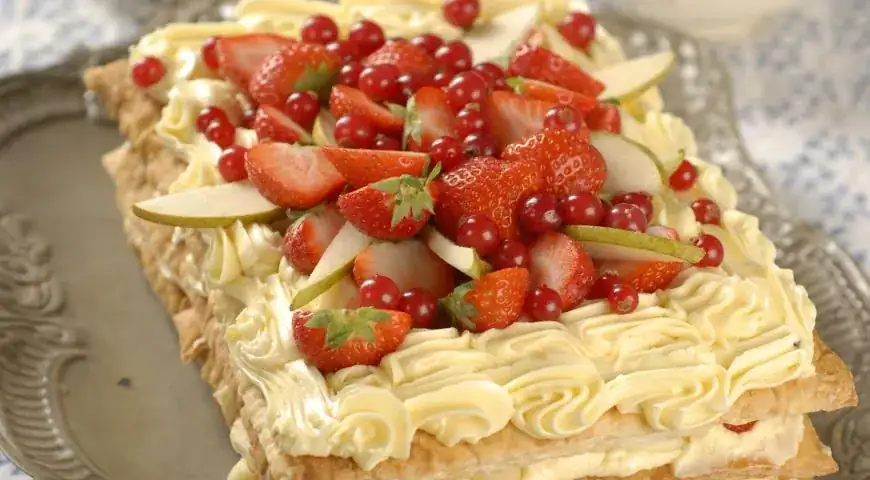 Fruit and berry Napoleon cake in mint syrup