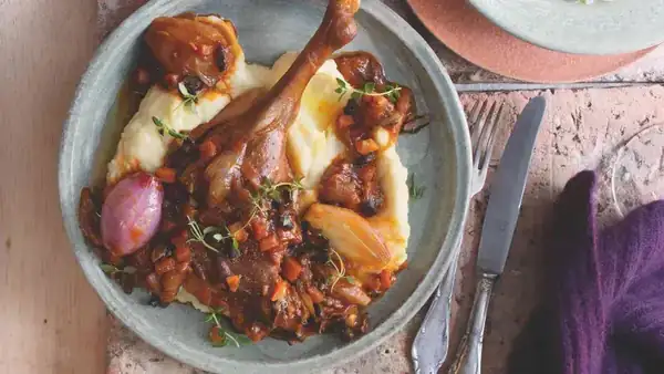 Roasted goose leg with vegetable ragout with mushrooms and celery puree