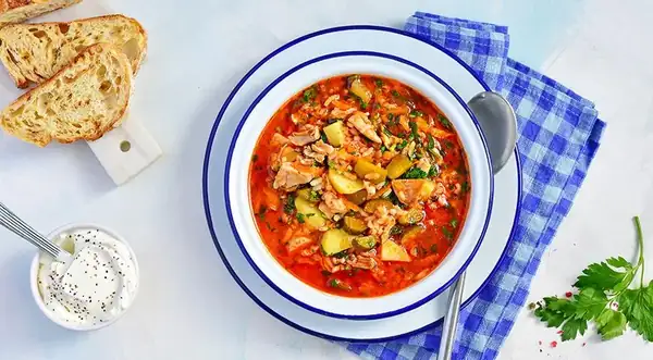 Rassolnik with rice and tomato paste