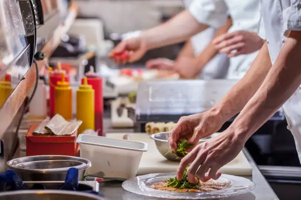 Why Is the Brigade System Essential in Restaurant Kitchens?