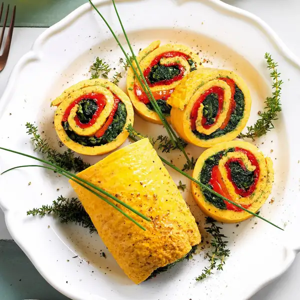 Omelette roll filled with sautéed chicory and peppers