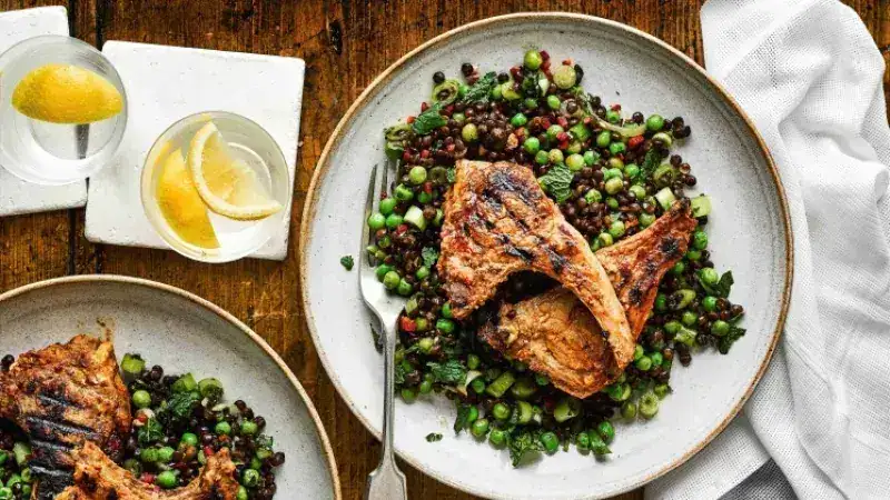 Lamb chops with cumin on lentil salad