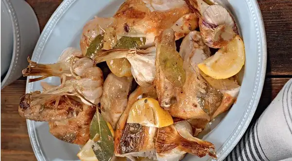 Chicken baked with garlic and bay leaves