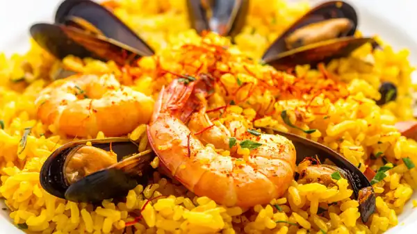 This creamy seafood rice is even better if you use those spices you have hidden at the back of the pantry.