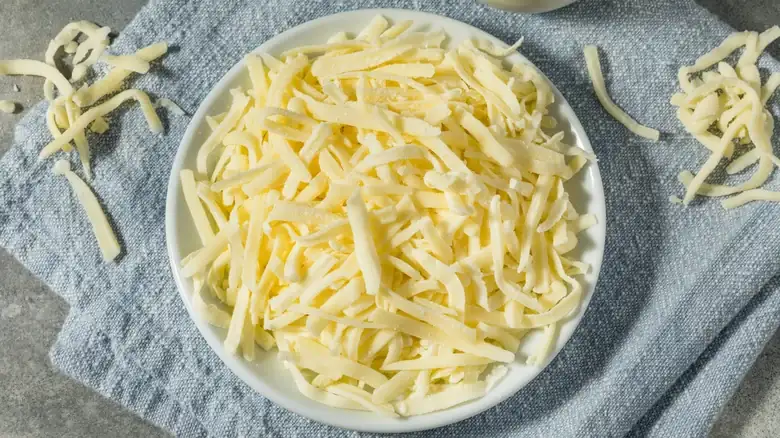 Ever Wonder What The Powdered Substance On Shredded Cheese Is?