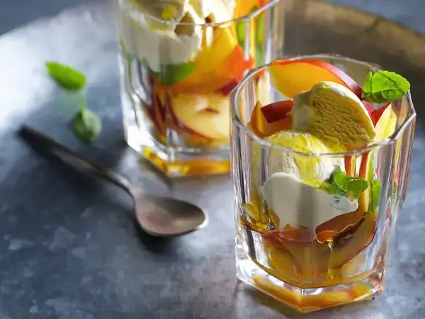 Nectarine salad with vanilla ice cream and olive oil