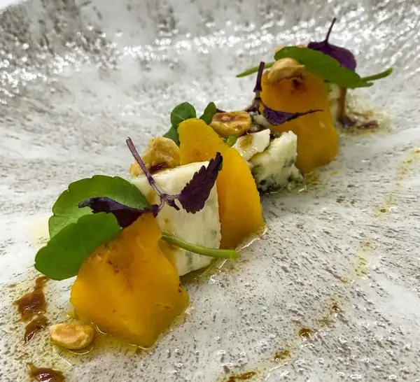 Autumn salad with pumpkin, blue cheese, hazelnuts, watercress and ratafia vinaigrette