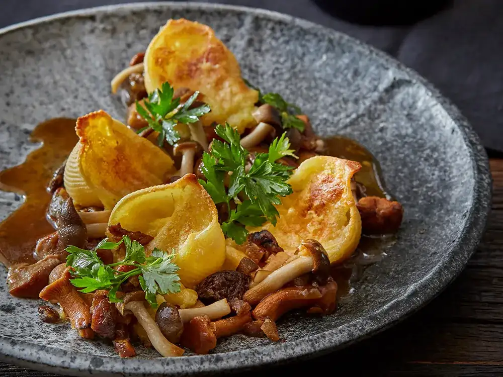 Stuffed conchiglioni with potatoes and wild mushrooms