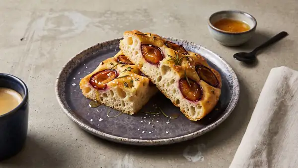 Fluffy plum focaccia with rosemary and a hint of honey