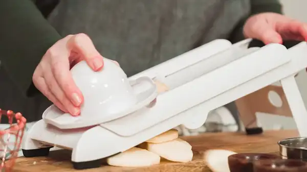 Why You Should Consider A Mini Mandoline Over A Full-Sized One