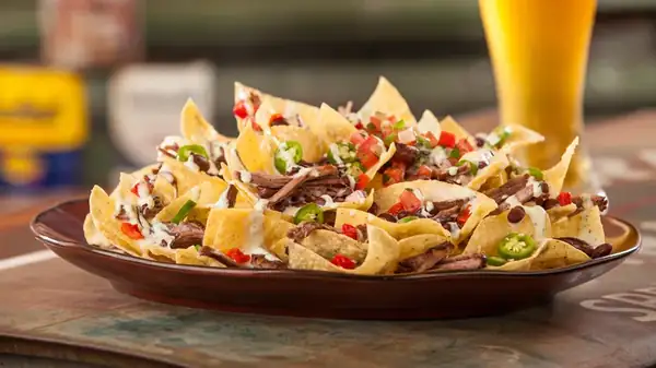 The Trick To Reheating Leftover Nachos Without Making A Soggy Mess