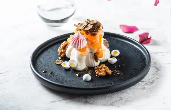 Pavlova with Tangerine and Black Truffles