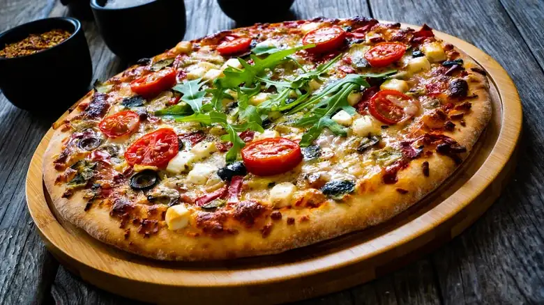 Give Pizza A Tangy Twist With A Creamy Cheese Swap