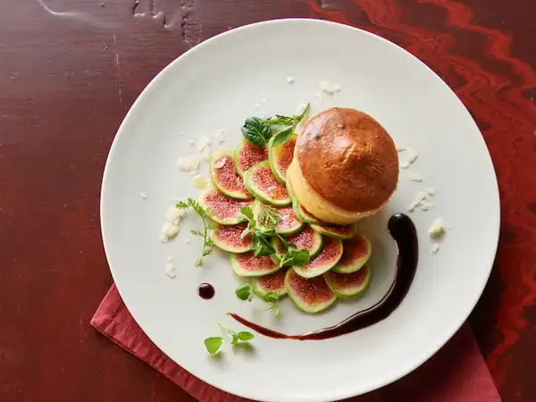 Parmesan soufflé with fig carpaccio and aged balsamic vinegar