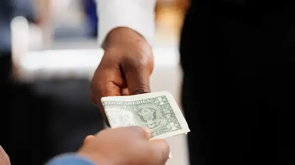 The Rules To Live By When Tipping On A Split Check At A Restaurant