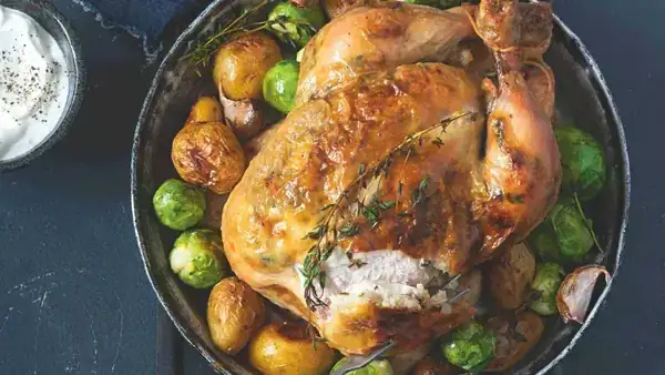 Lard-enhanced roasted chicken with potatoes & warm red cabbage salad