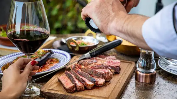 The Red Wine And Meat Pairing Advice You Should Take With A Grain Of Salt