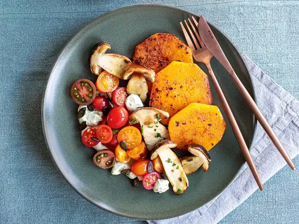 Butternut squash with tomatoes, porcini mushrooms and pumpkin seed oil ricotta