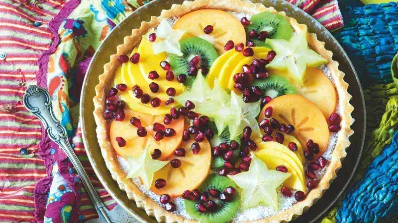 Cake with coconut cream and tropical fruits