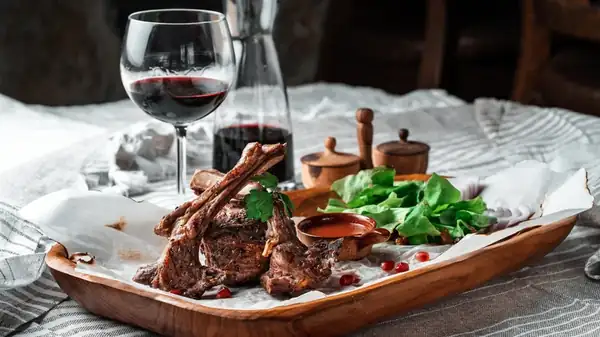 Why Red Wine Should Be Your Go-To Pairing For Lamb