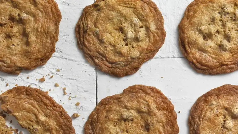 Yes, tapping the baking tray improves the crispiness of the cookies