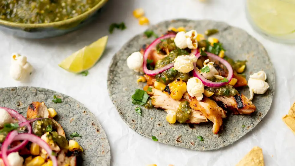 Tacos with grilled chicken, popcorn, and roasted corn