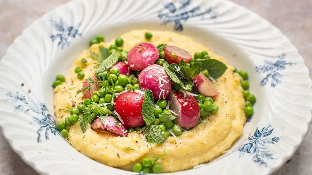 Polenta with radishes fried in butter, peas, and pecorino