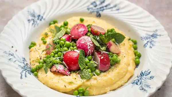 Polenta with radishes fried in butter, peas, and pecorino