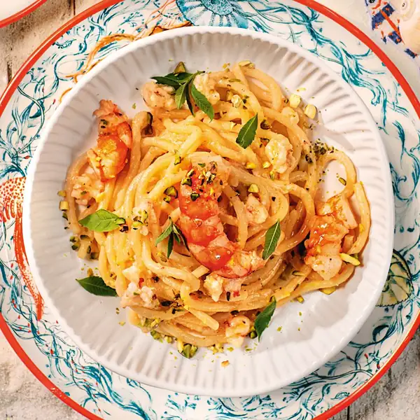 Pici with shrimp, lemon, and pistachio pesto
