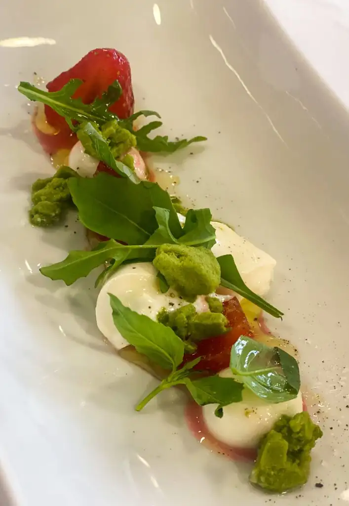 Strawberries in sherry with burrata and basil