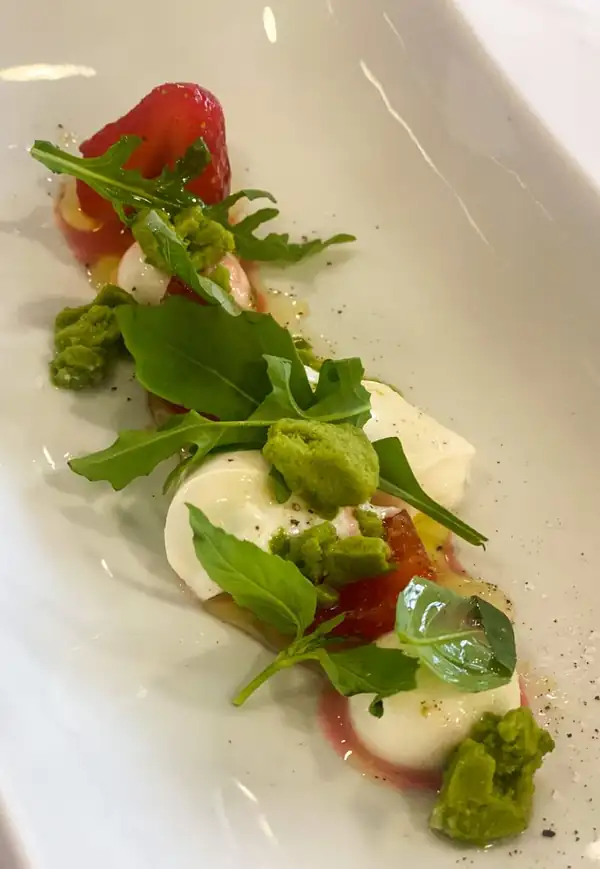 Strawberries in sherry with burrata and basil