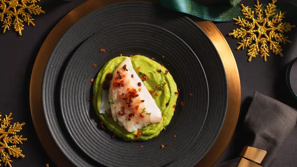 Hake with broccoli stem cream, olives and crispy spianata