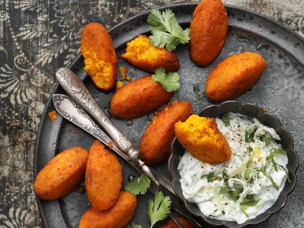 Baked pumpkin and saffron falafel with cucumber raita