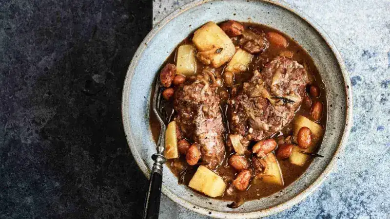 Pork cheeks stewed with beans, parsnips and pears