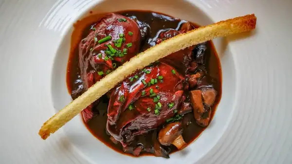 Eggs meurette, a French dish of poached eggs in red wine sauce