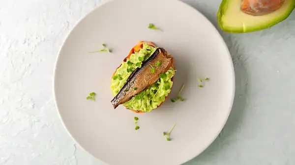 One Fishy Addition Gives Avocado Toast A Briny Boost Of Flavor