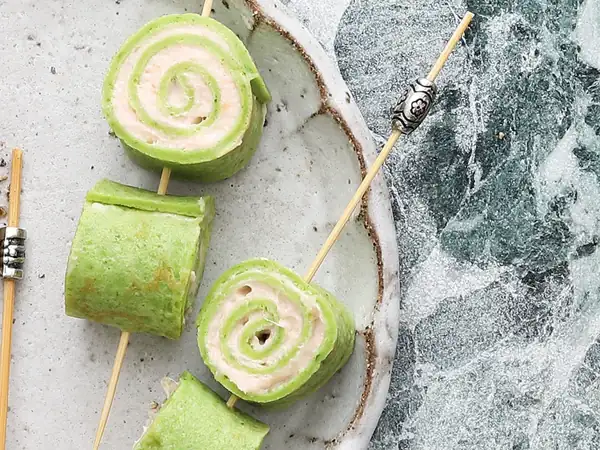 Herb crepe rolls with smoked salmon