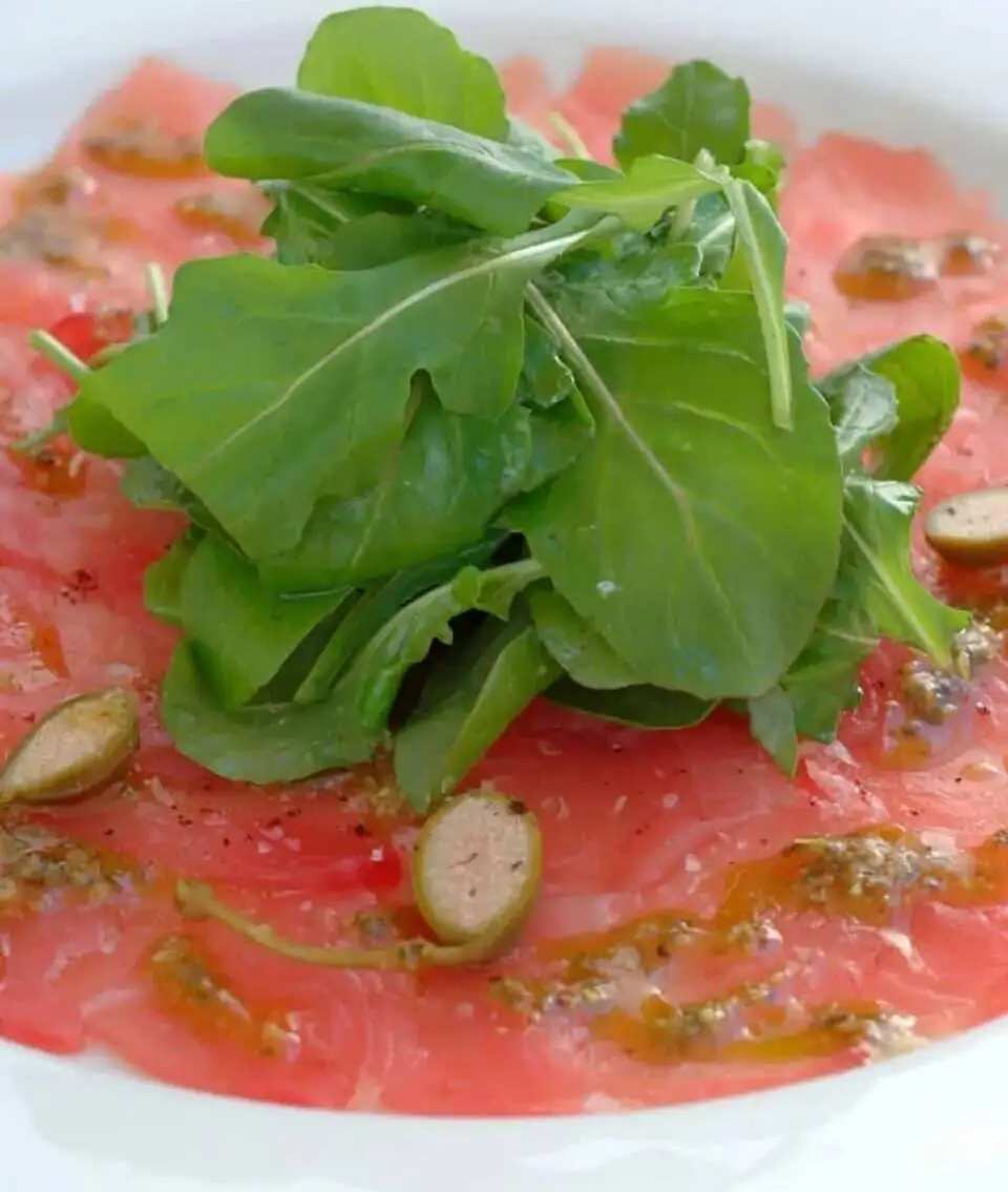 Tuna Carpaccio with Basil Oil, Lemon and Caper Berries