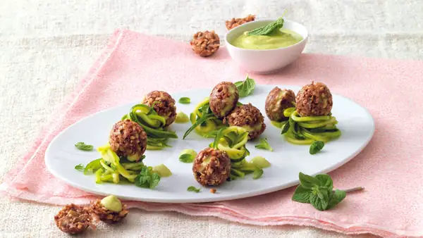 Baci di dama with Grana Padano in courgette nests
