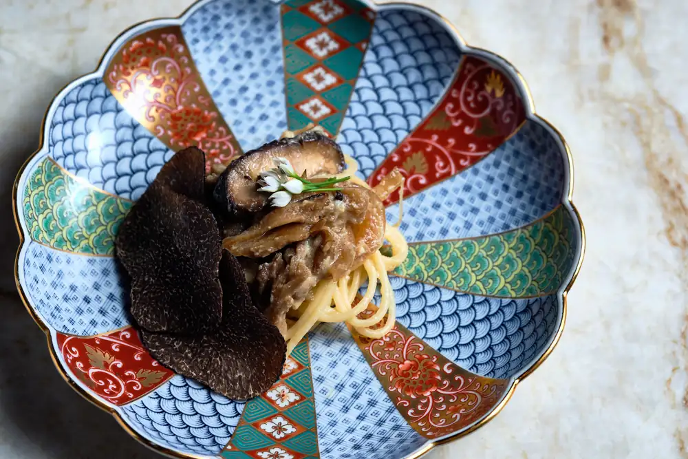 Ryokou serves pasta at its Atlanta omakase, with ice imported from Japan