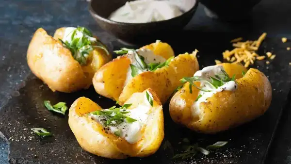 “Baked” stuffed potatoes with cheese and spring onions
