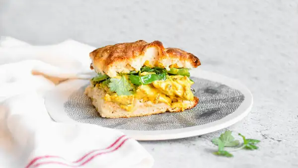 This chicken curry salad sandwich with charred spring onions and coriander is unbelievably delicious
