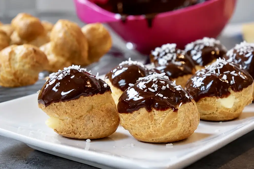 Profiteroles with vanilla pastry cream and chocolate sauce
