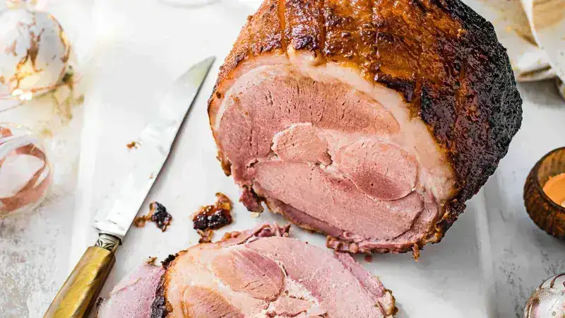 Baked ham in cider with kale
