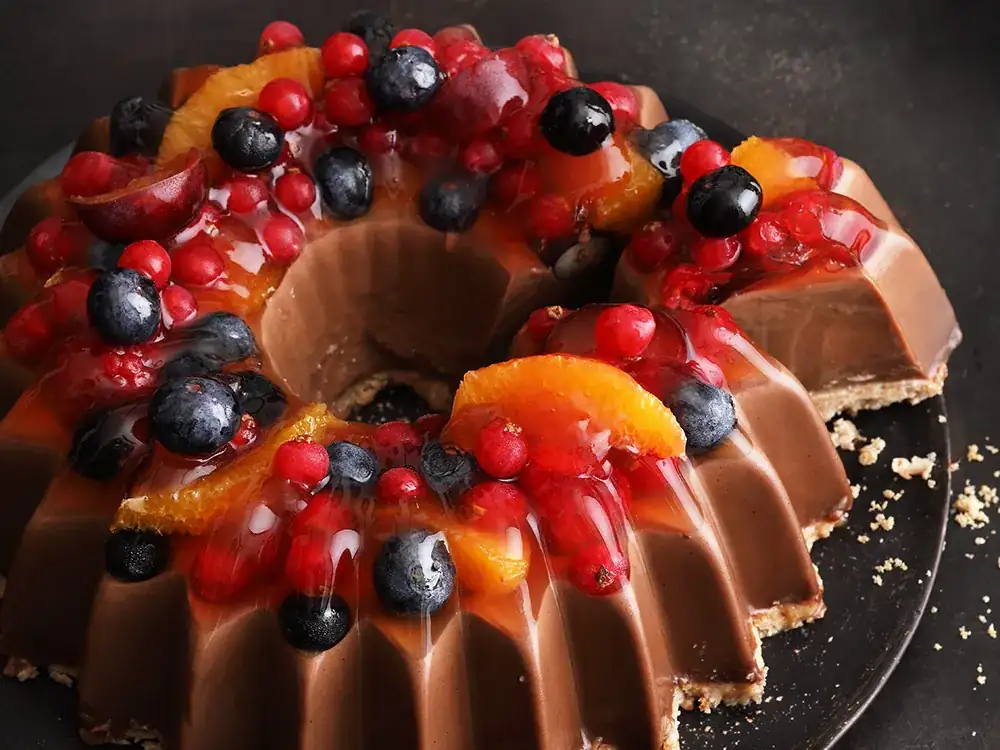 Chocolate cinnamon panna cotta with rum-soaked fruit jelly