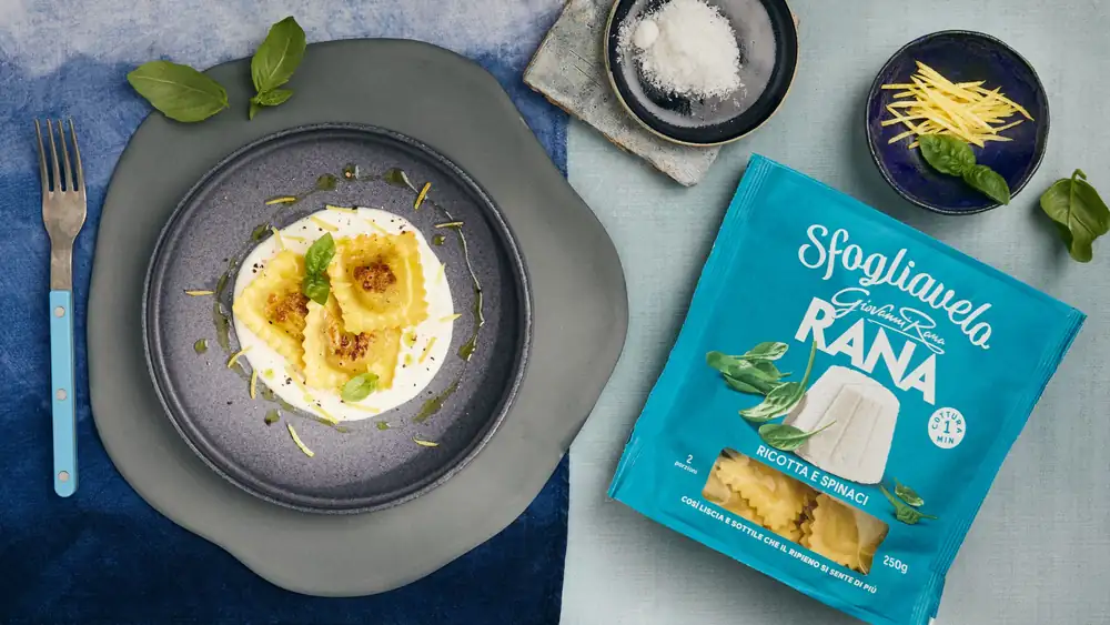 Ricotta and spinach sfogliavelo gyoza-style, with parmesan fondue, lemon zest, and basil oil by Alessia Colonna