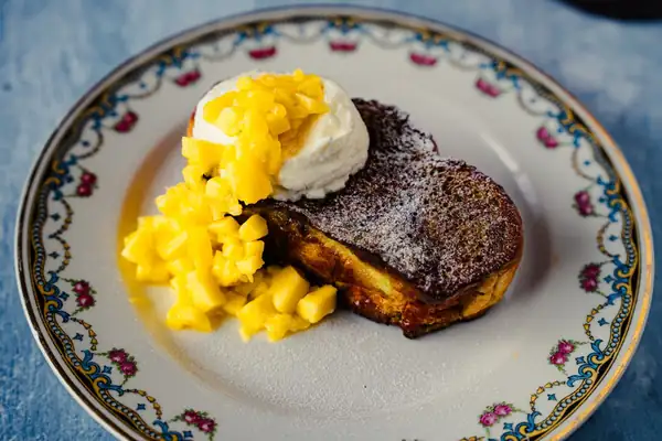 French toast, but next level: pandan, coconut mascarpone, and mango on one plate